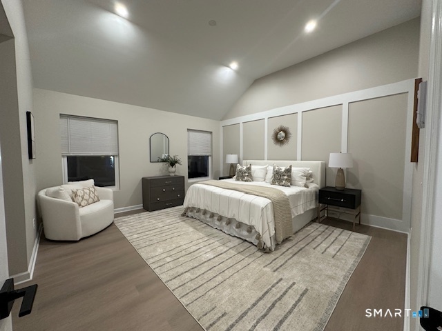 74 Soundview Avenue Fairfield, CT 06825 - Photo 10 of 32 a bedroom with a large bed and a couch