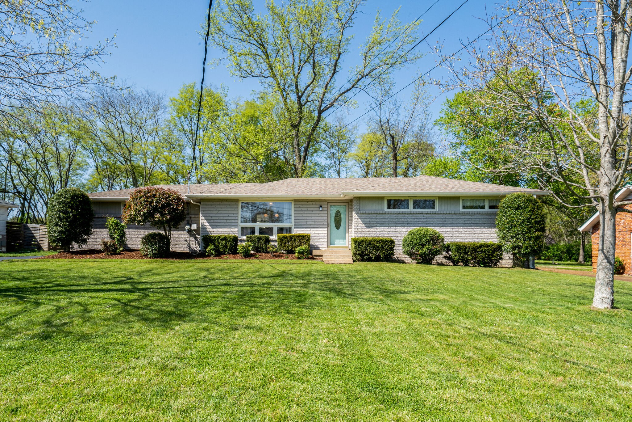 338 Stable Road Franklin, TN 37069 - Photo 1 of 26 a view of a house with backyard sitting area and garden