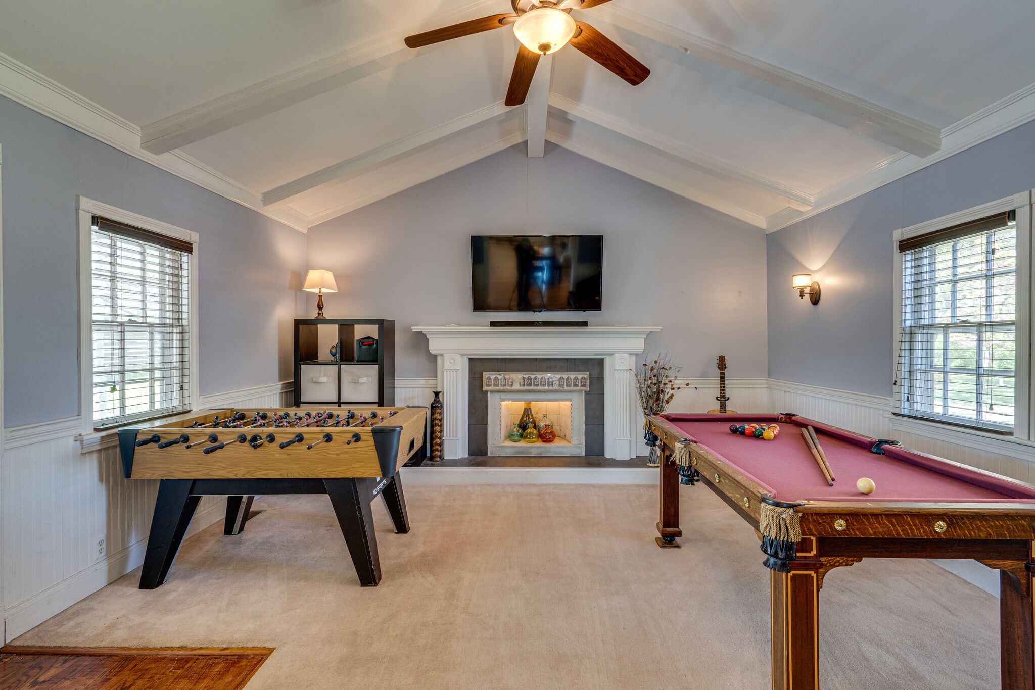 338 Stable Road Franklin, TN 37069 - Photo 12 of 26 a living room with furniture a flat screen tv and a fireplace