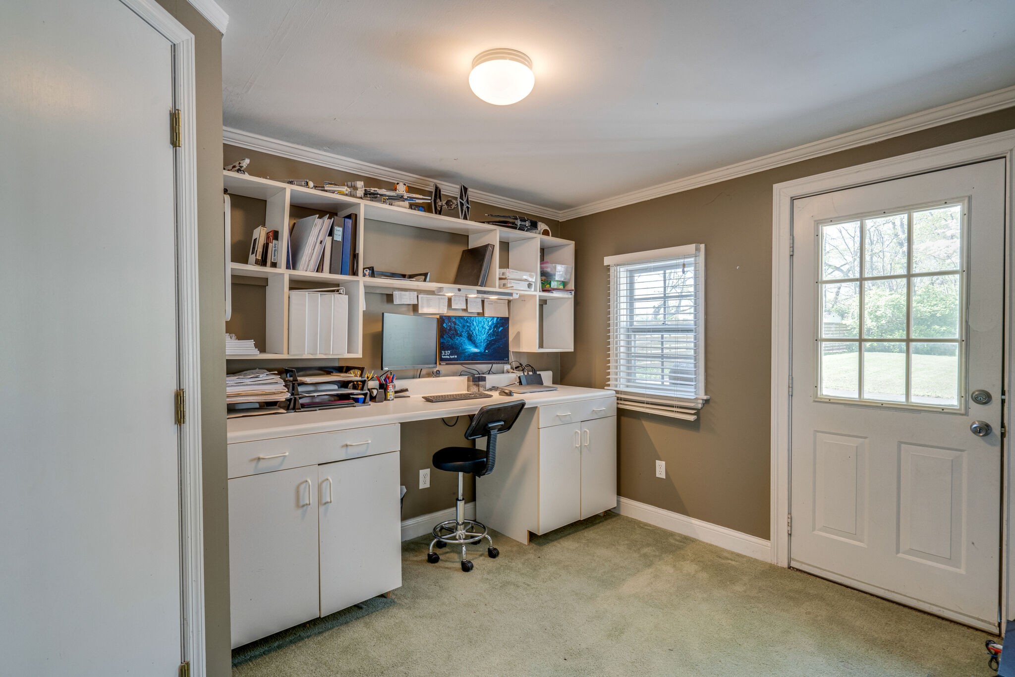338 Stable Road Franklin, TN 37069 - Photo 20 of 26 a view of workspace with wooden floor and white cabinets