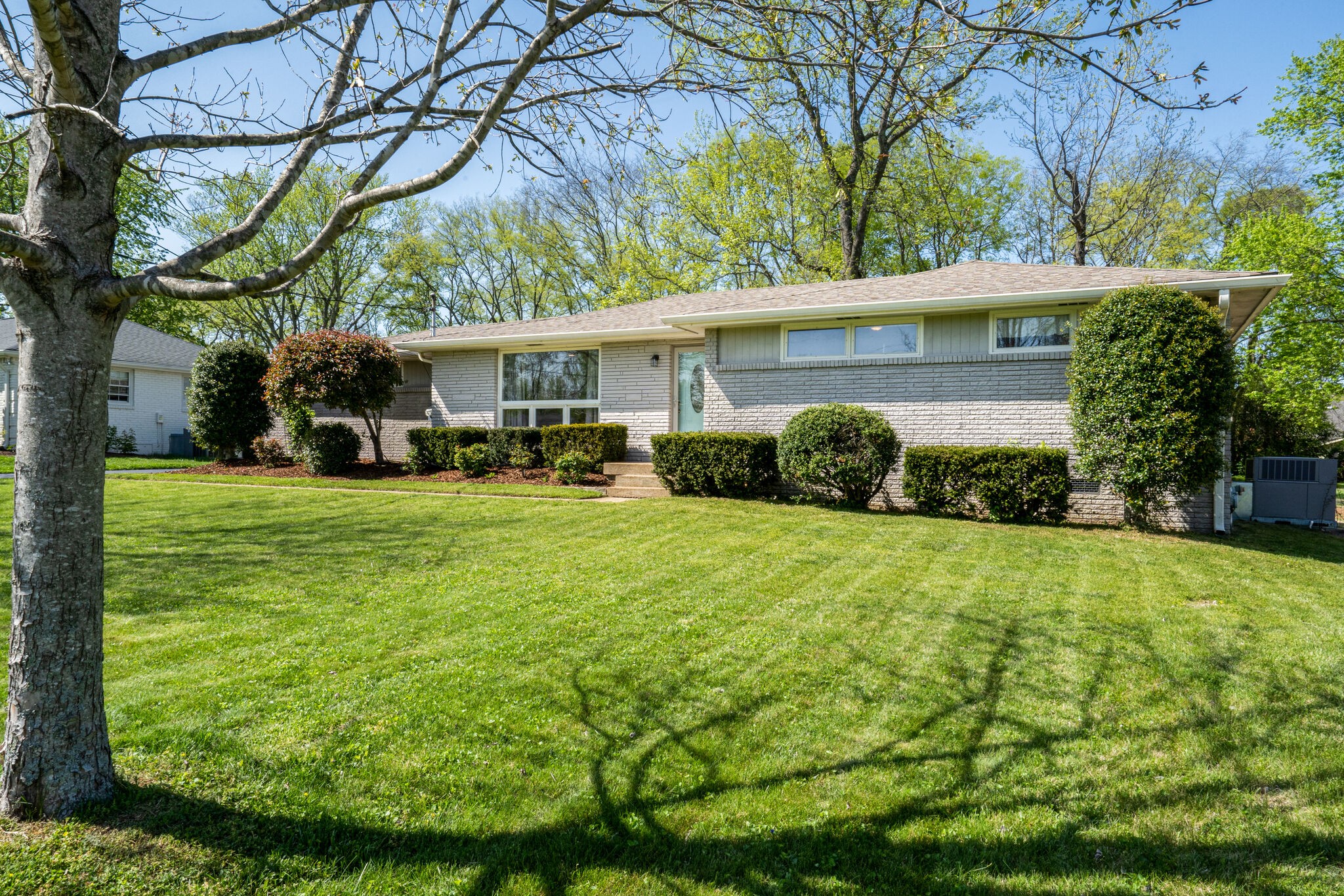 338 Stable Road Franklin, TN 37069 - Photo 2 of 26 a view of a house with backyard and garden