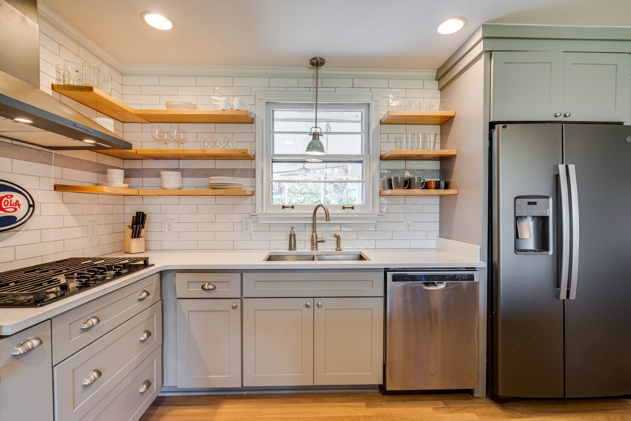 338 Stable Road Franklin, TN 37069 - Photo 6 of 26 a kitchen with stainless steel appliances granite countertop a sink stove and refrigerator