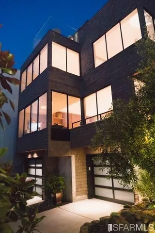 a view of a patio with a dining table and chairs with couches