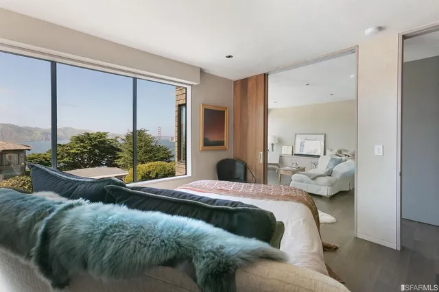 a bathroom with a sink a vanity and a large mirror