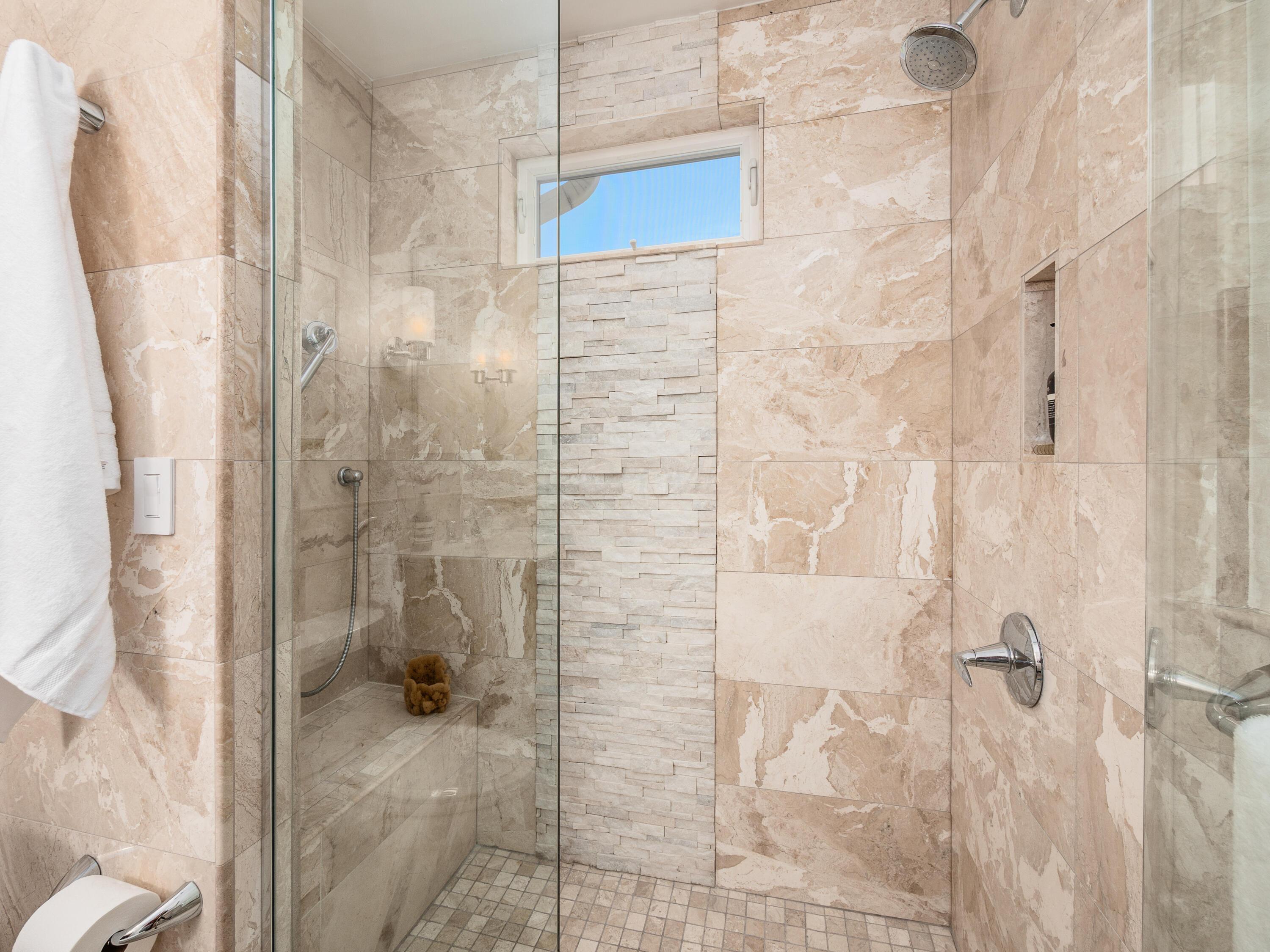 529 Crestview Road Columbus, OH 43202 - Photo 24 of 35 a zero-entry shower of travertine tile.