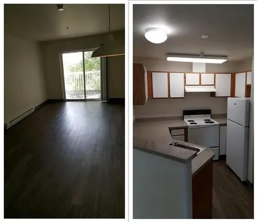 a view of kitchen with windows and refrigerator