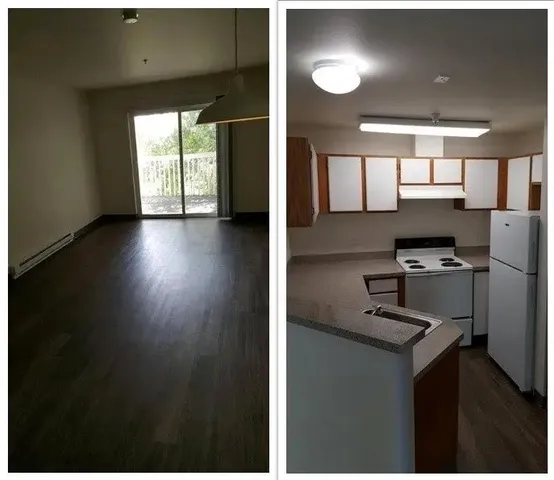 a view of kitchen with windows and refrigerator