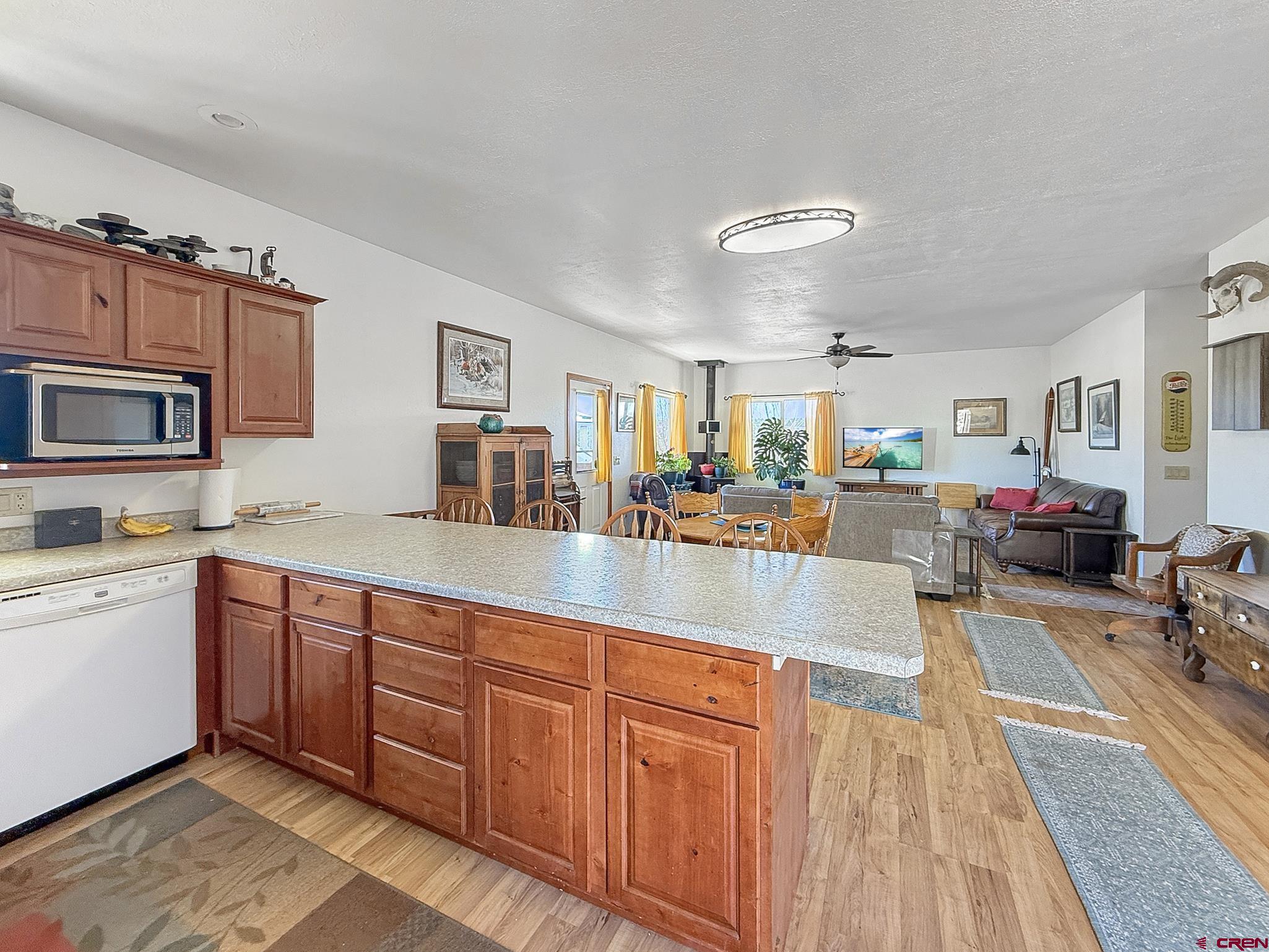 240 F Street Crawford, CO 81415 - Photo 15 of 45 a large kitchen with stainless steel appliances granite countertop a lot of counter space and a sink