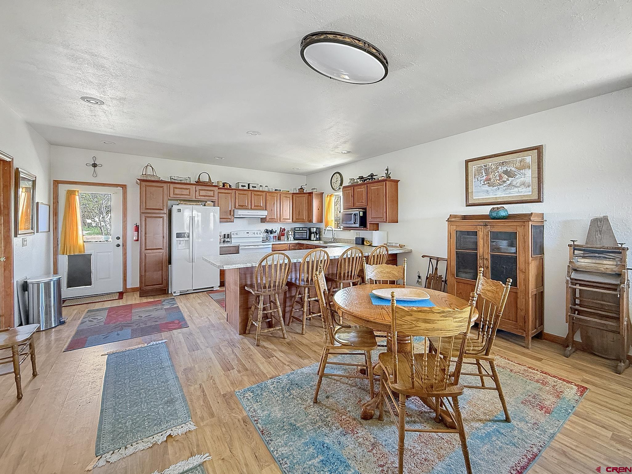 240 F Street Crawford, CO 81415 - Photo 16 of 45 a dining room with furniture and wooden floor