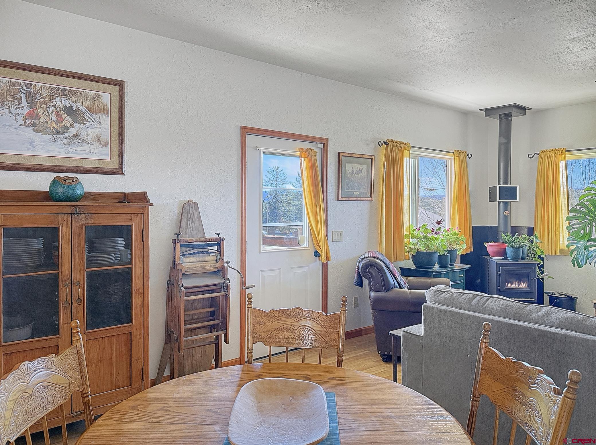 240 F Street Crawford, CO 81415 - Photo 18 of 45 a living room with furniture a large window and a flat screen tv