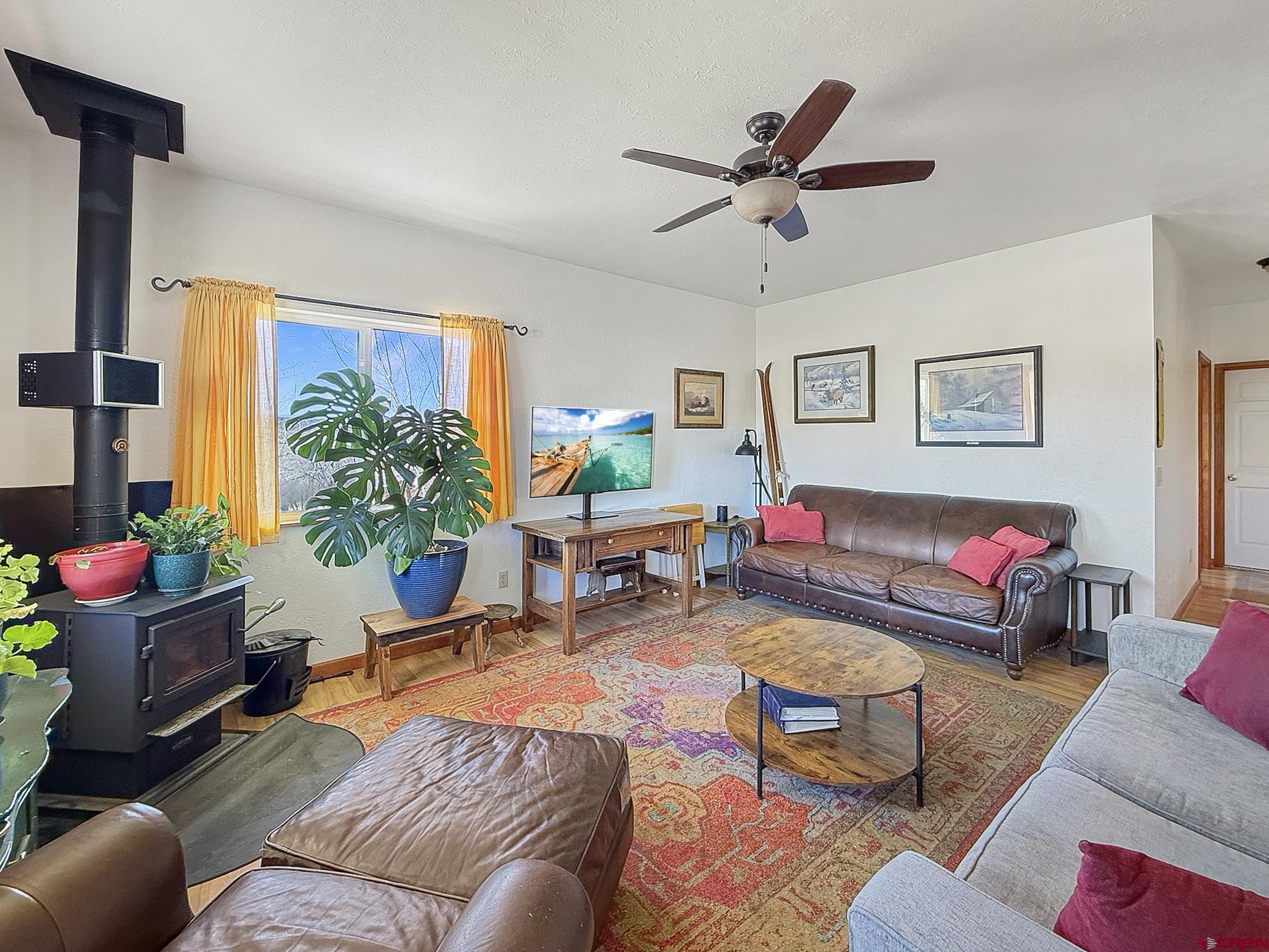 240 F Street Crawford, CO 81415 - Photo 2 of 45 a living room with furniture and a large window