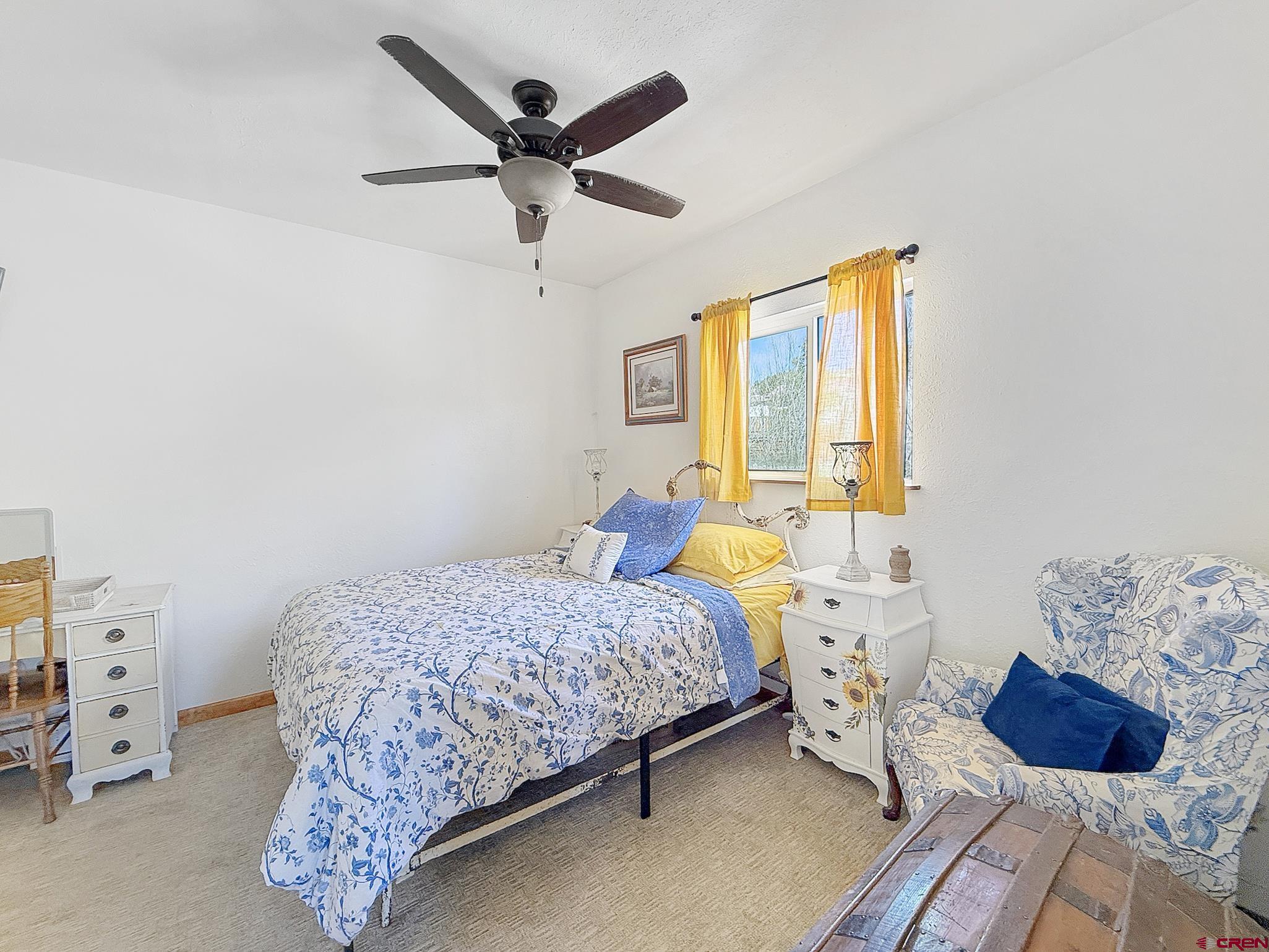 240 F Street Crawford, CO 81415 - Photo 24 of 45 a bedroom with a bed and a window