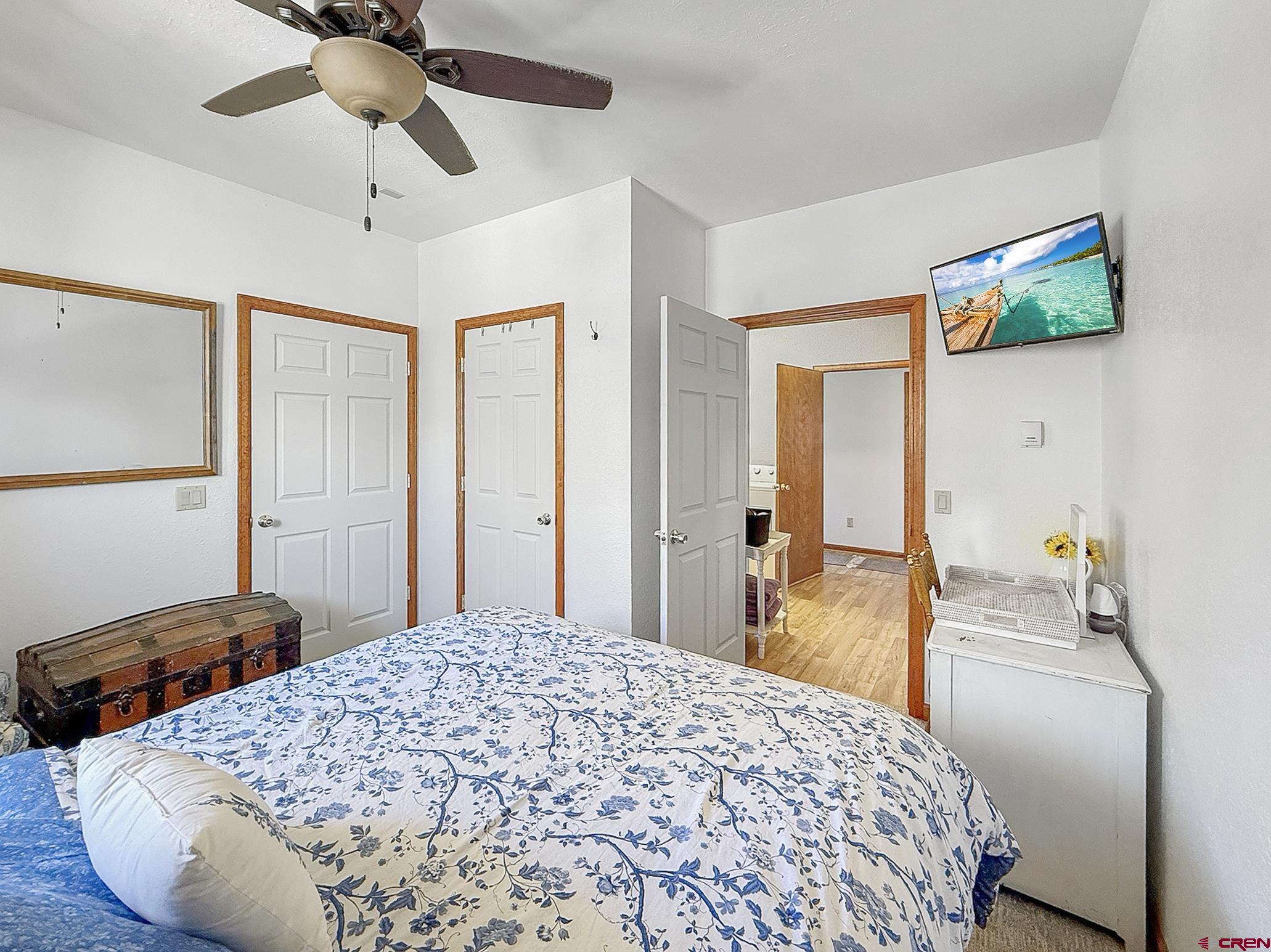 240 F Street Crawford, CO 81415 - Photo 25 of 45 a bedroom with a bed and a chandelier