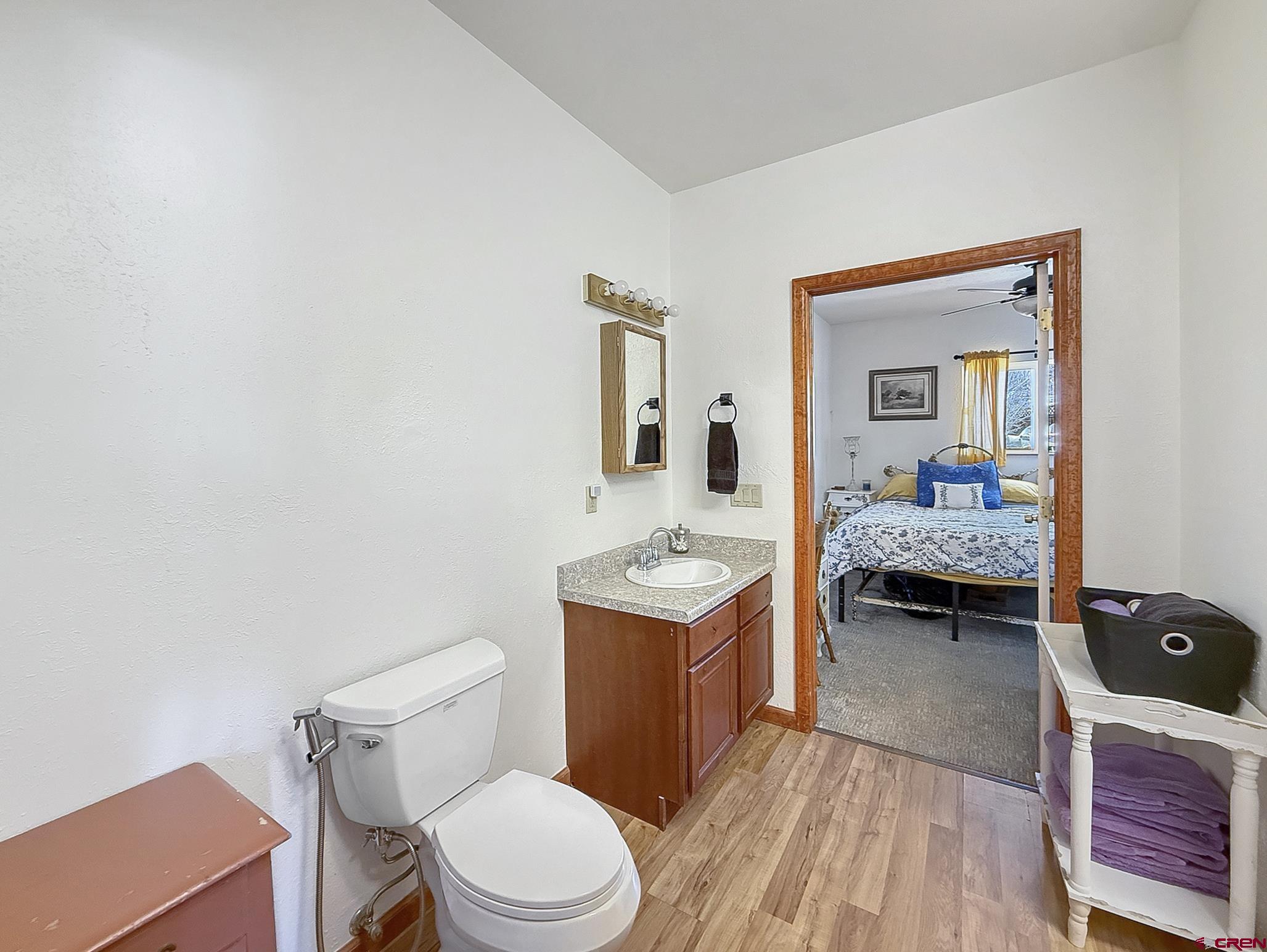 240 F Street Crawford, CO 81415 - Photo 29 of 45 a en suite bathroom with a sink and a mirror