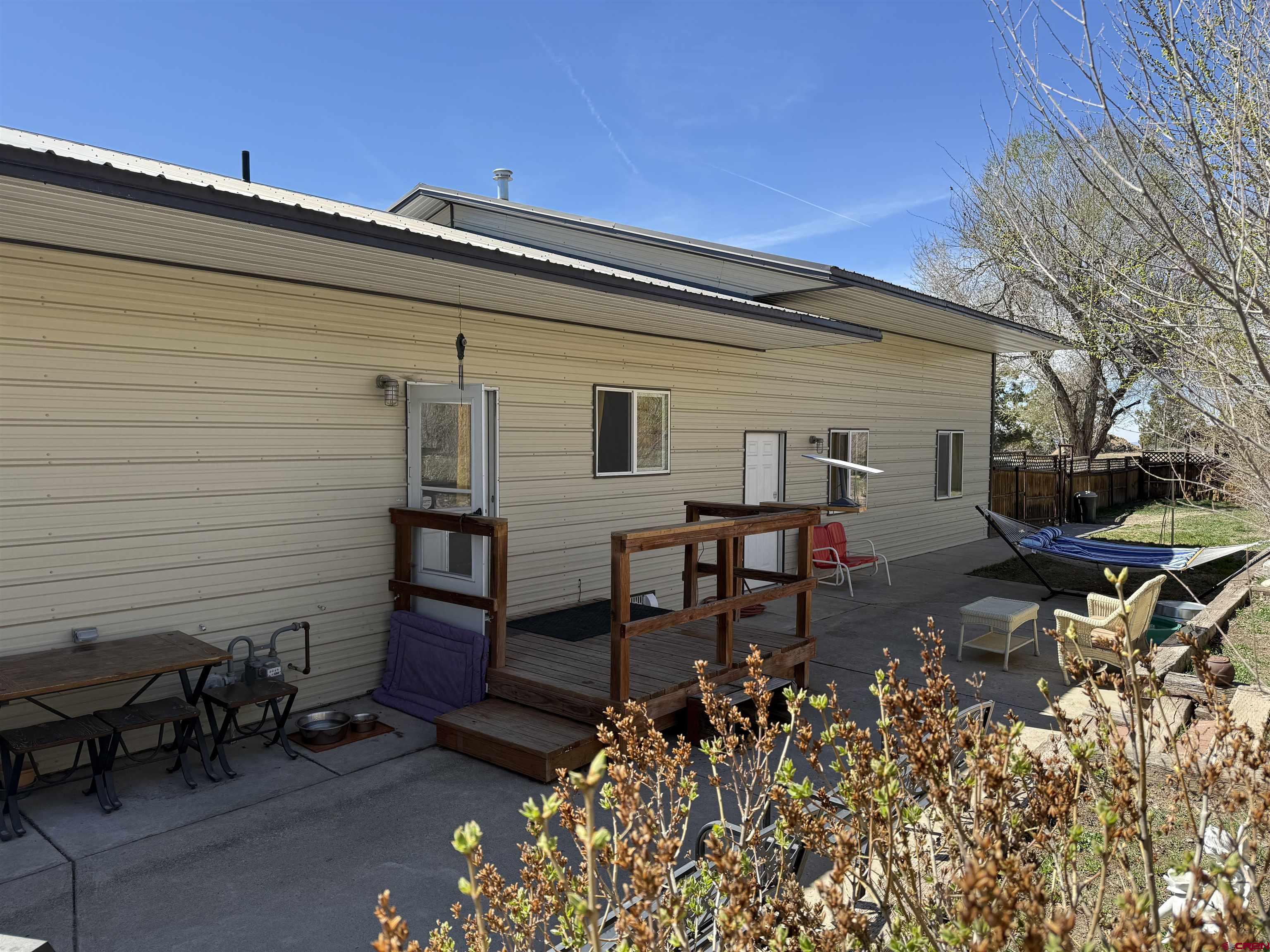 240 F Street Crawford, CO 81415 - Photo 40 of 45 a backyard of a house with table and chairs