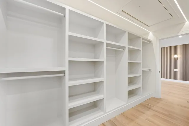 a bathroom with a sink a large mirror and a bathtub