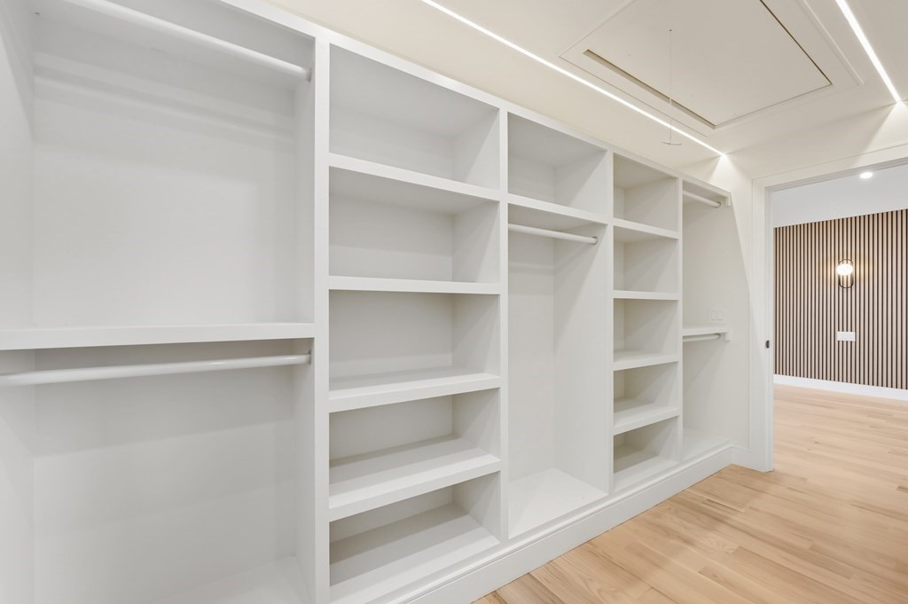 863 Main Street Reading, MA 01867 - Photo 23 of 42 a view of walk in closet with empty racks