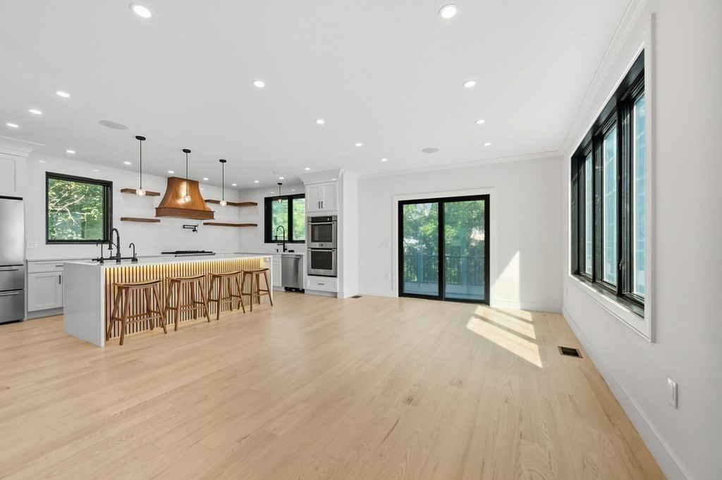 863 Main Street Reading, MA 01867 - Photo 27 of 42 a large kitchen with a large window and stainless steel appliances