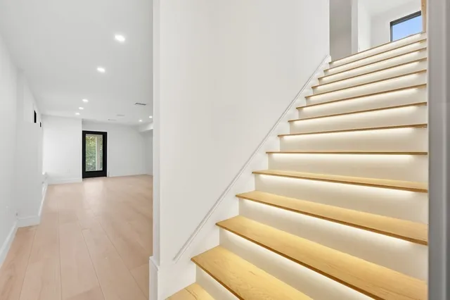 a large white kitchen with a sink