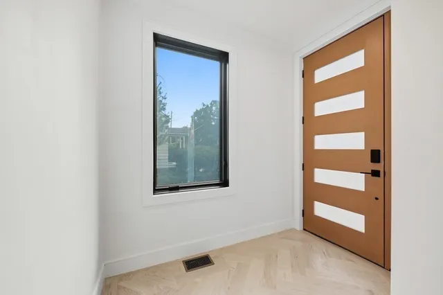 a view of balcony with wooden floor and fence