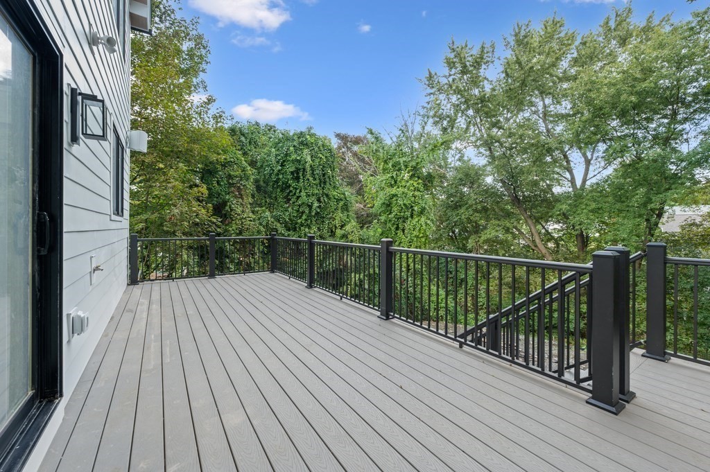 863 Main Street Reading, MA 01867 - Photo 35 of 42 a view of balcony with wooden floor and fence