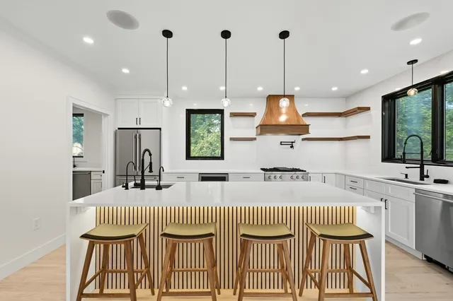 a kitchen that has a lot of counter space and a window