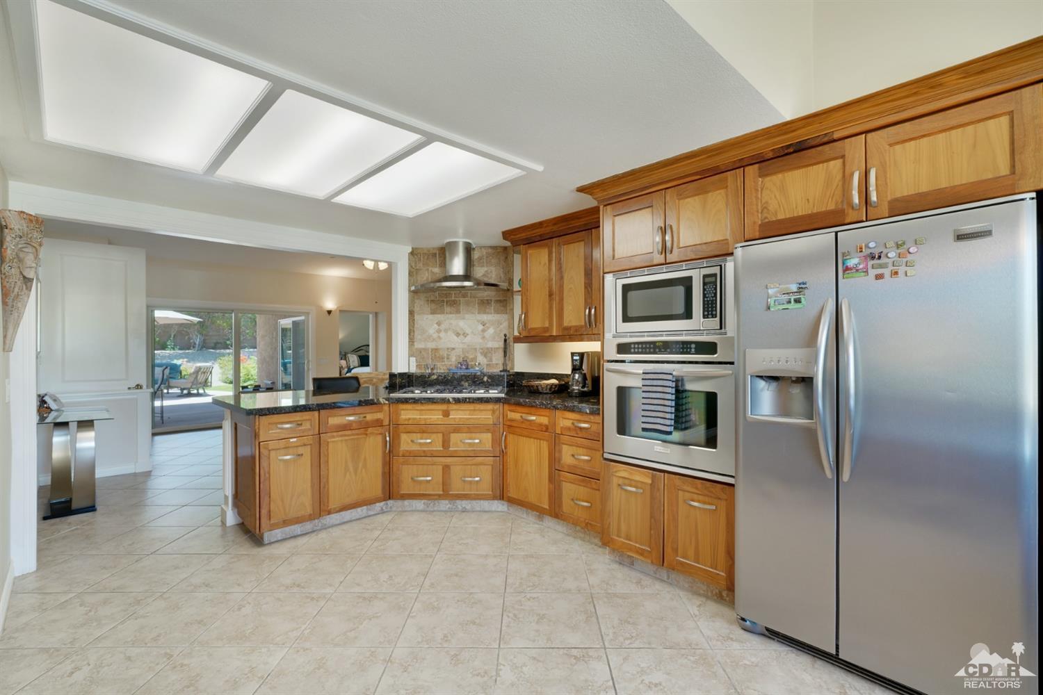72671 Homestead Road Palm Desert, CA 92260 - Photo 17 of 39 a large kitchen with stainless steel appliances lots of counter top space