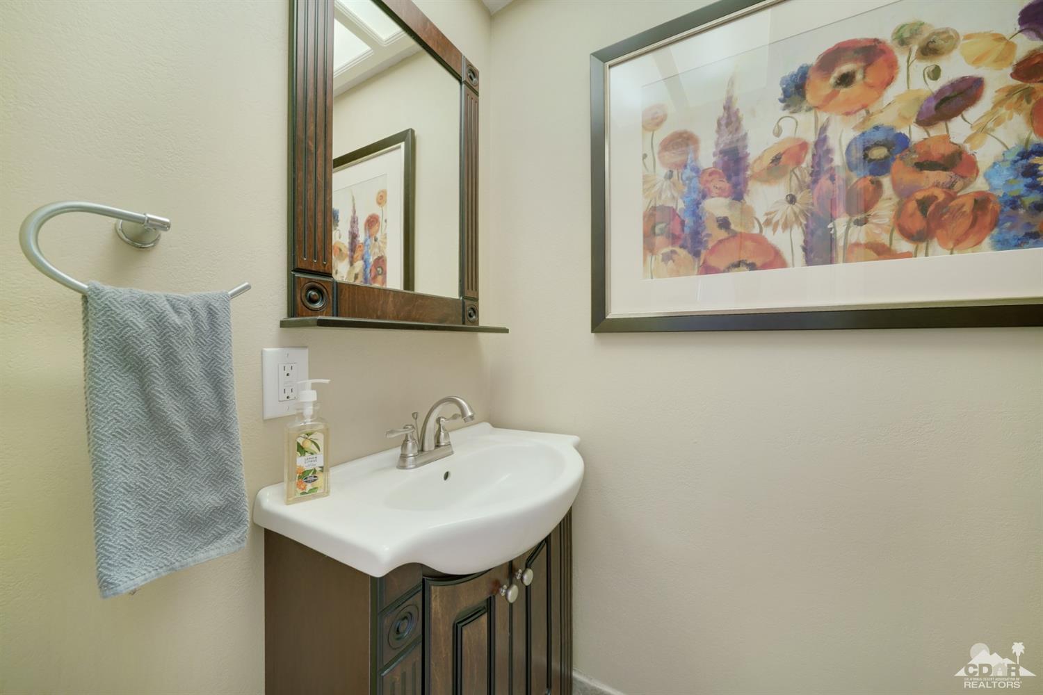 72671 Homestead Road Palm Desert, CA 92260 - Photo 20 of 39 a bathroom with a sink and a mirror
