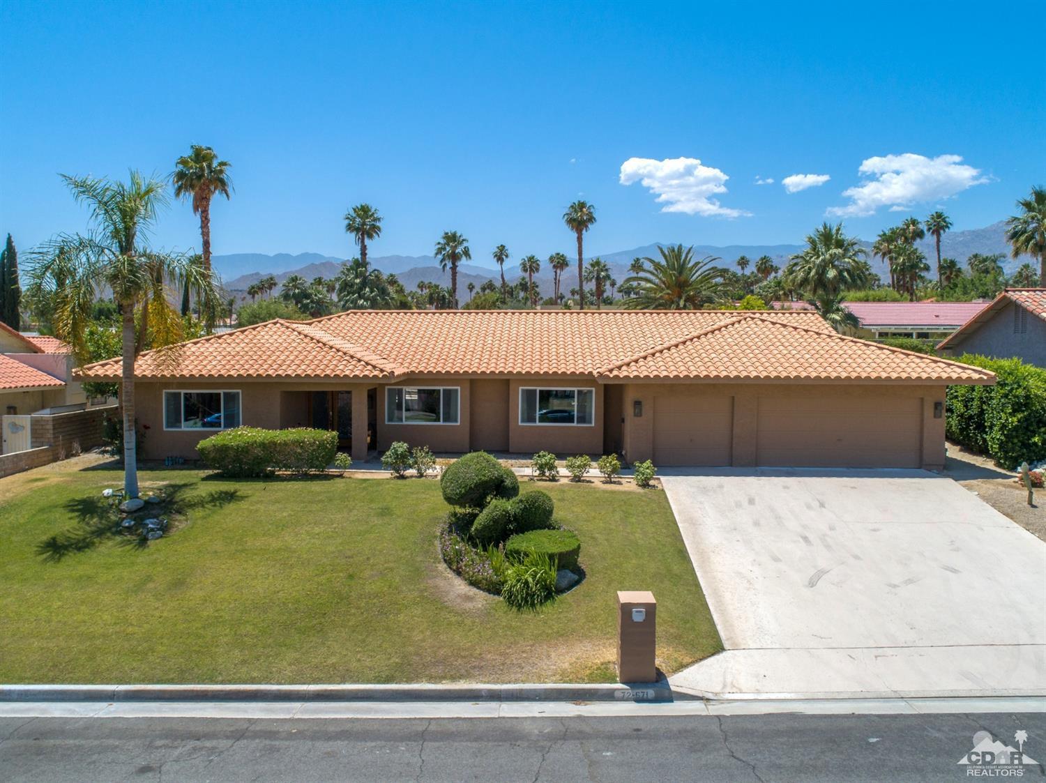 72671 Homestead Road Palm Desert, CA 92260 - Photo 3 of 39 a front view of a house with garden