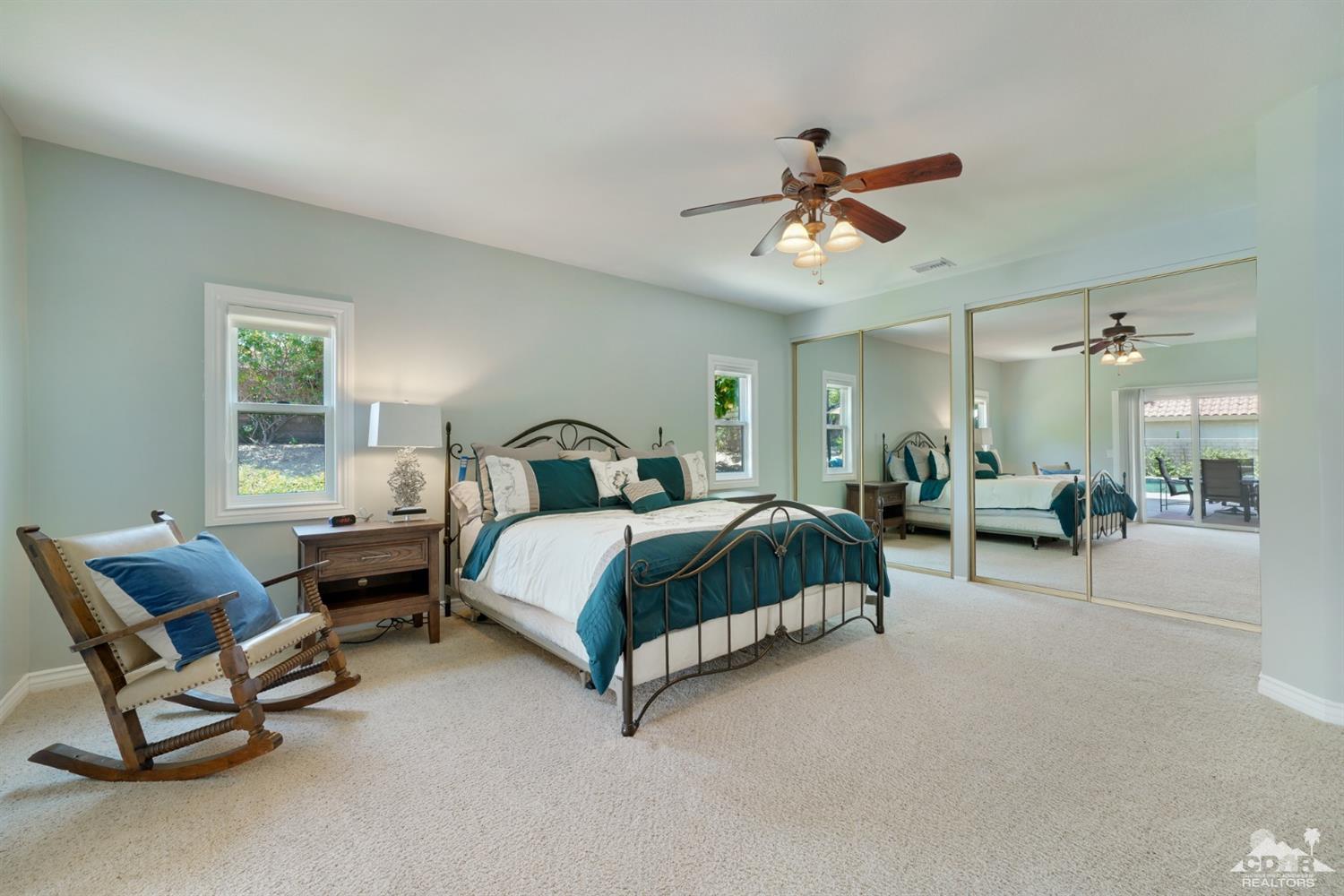 72671 Homestead Road Palm Desert, CA 92260 - Photo 21 of 39 a bedroom with a bed chair and window