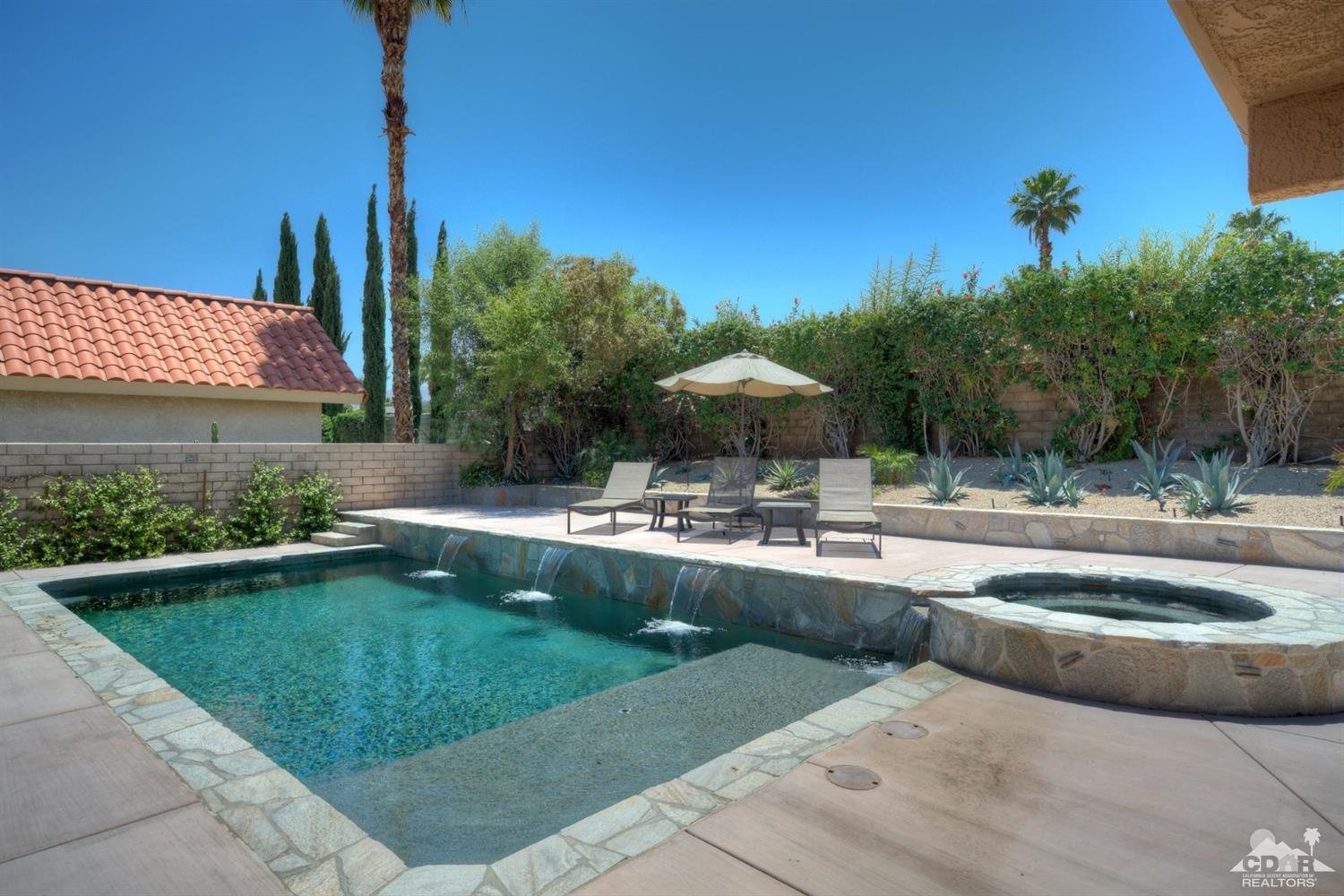 72671 Homestead Road Palm Desert, CA 92260 - Photo 33 of 39 a view of a swimming pool with a patio