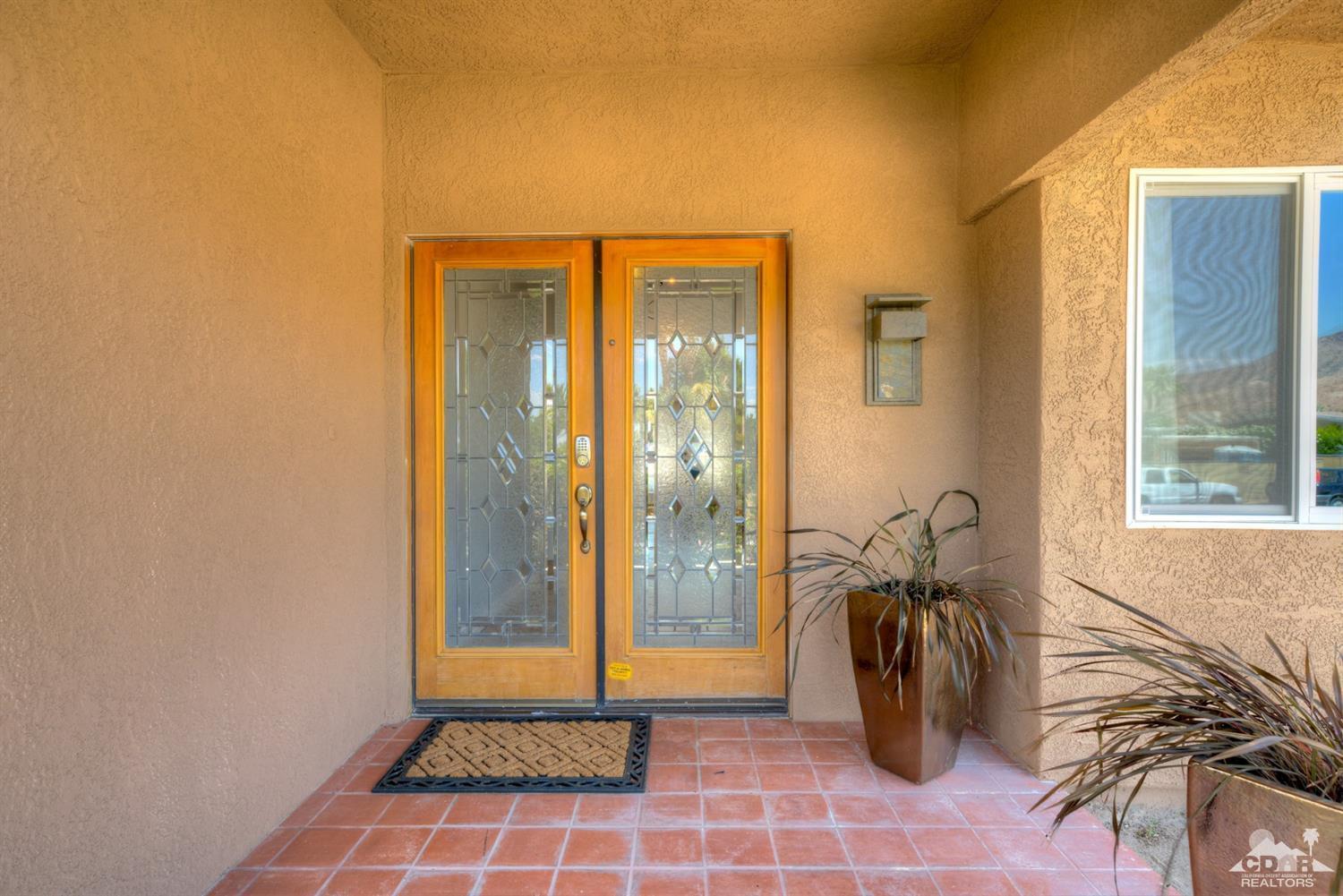 72671 Homestead Road Palm Desert, CA 92260 - Photo 5 of 39 a view of an entryway with a door