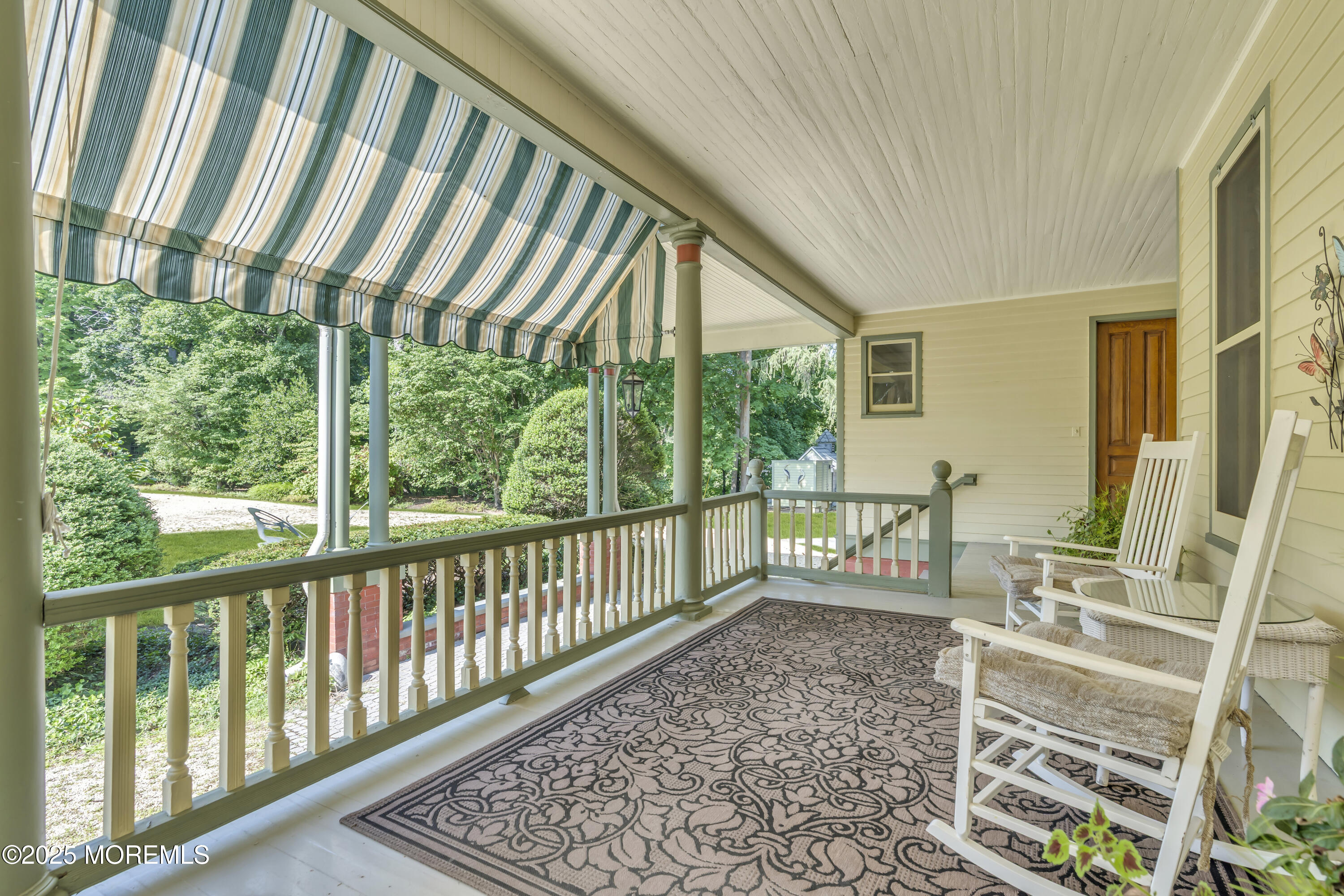 458 Navesink River Road Red Bank, NJ 07701 - Photo 111 of 118 a front view of a house with outdoor seating