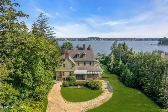 a living room with furniture large window and a fireplace