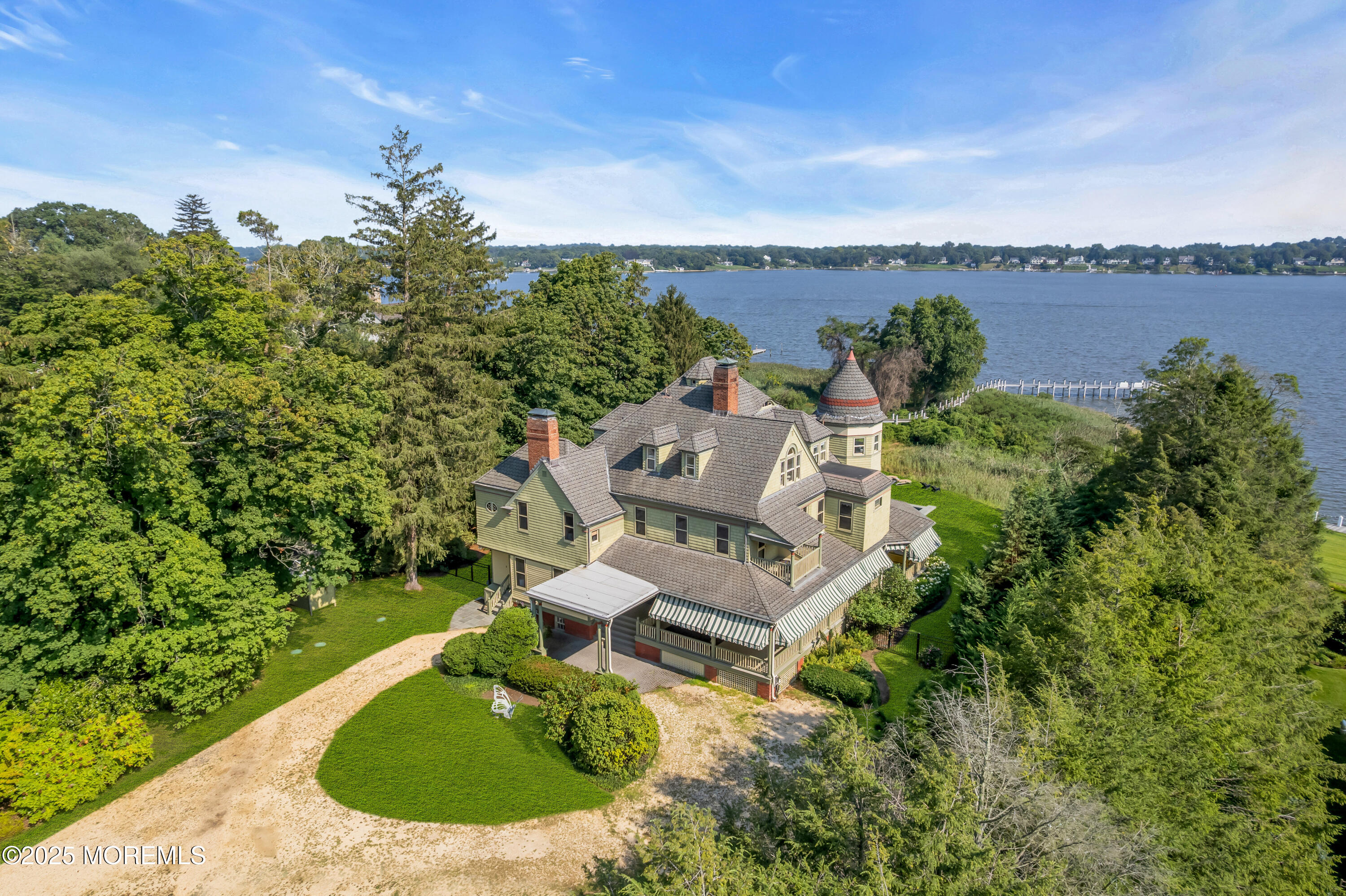 458 Navesink River Road Red Bank, NJ 07701 - Photo 13 of 118 an aerial view of a house with outdoor space swimming pool and lake view