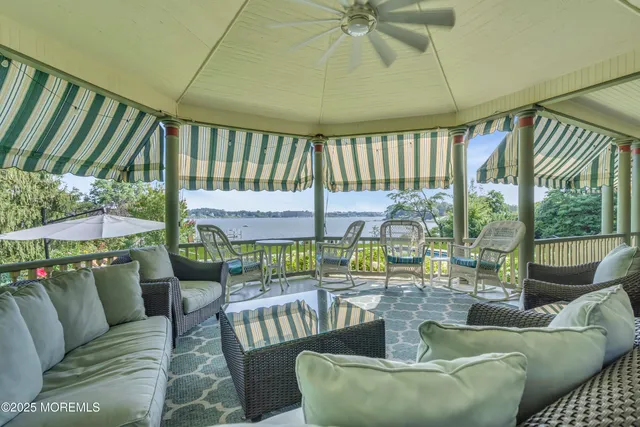 a white bath tub sitting in a bathroom next to a window