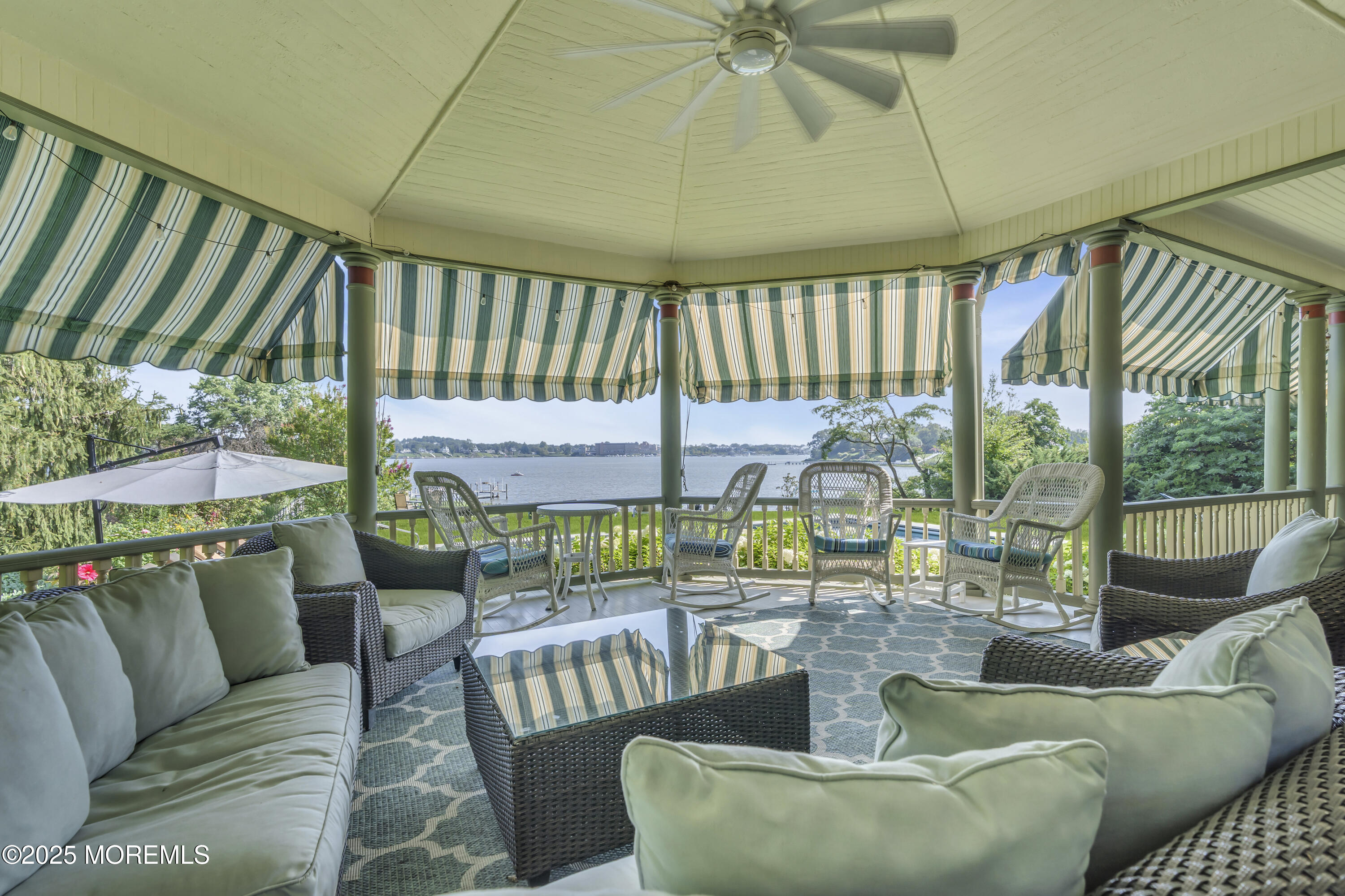 458 Navesink River Road Red Bank, NJ 07701 - Photo 33 of 118 a living room with furniture and a floor to ceiling window