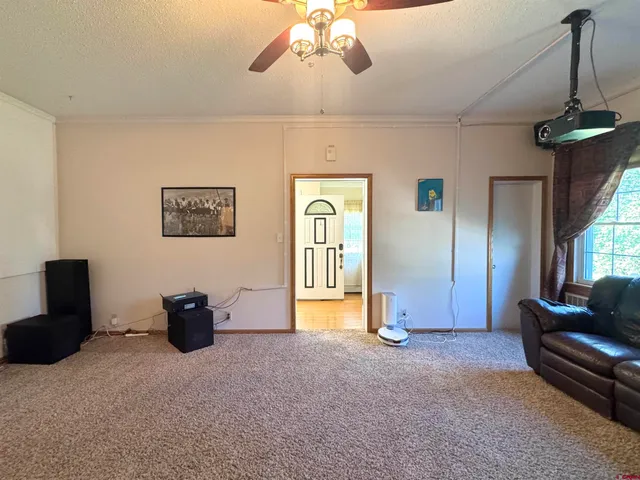 a view of livingroom with furniture and windows