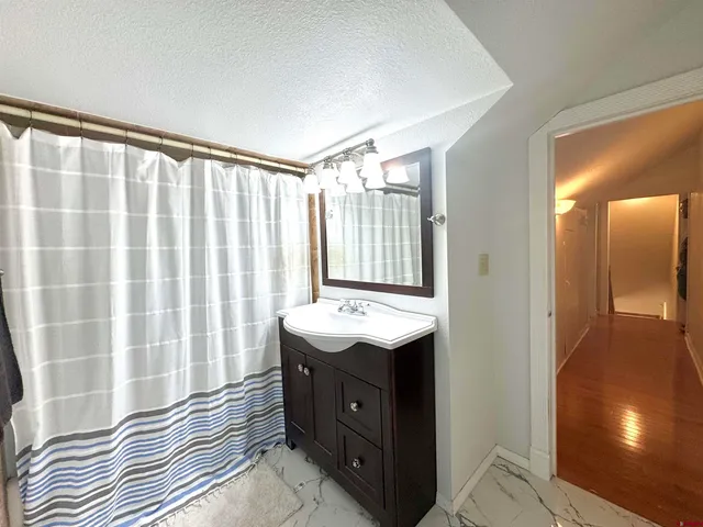 a bathroom with a sink double vanity and a mirror