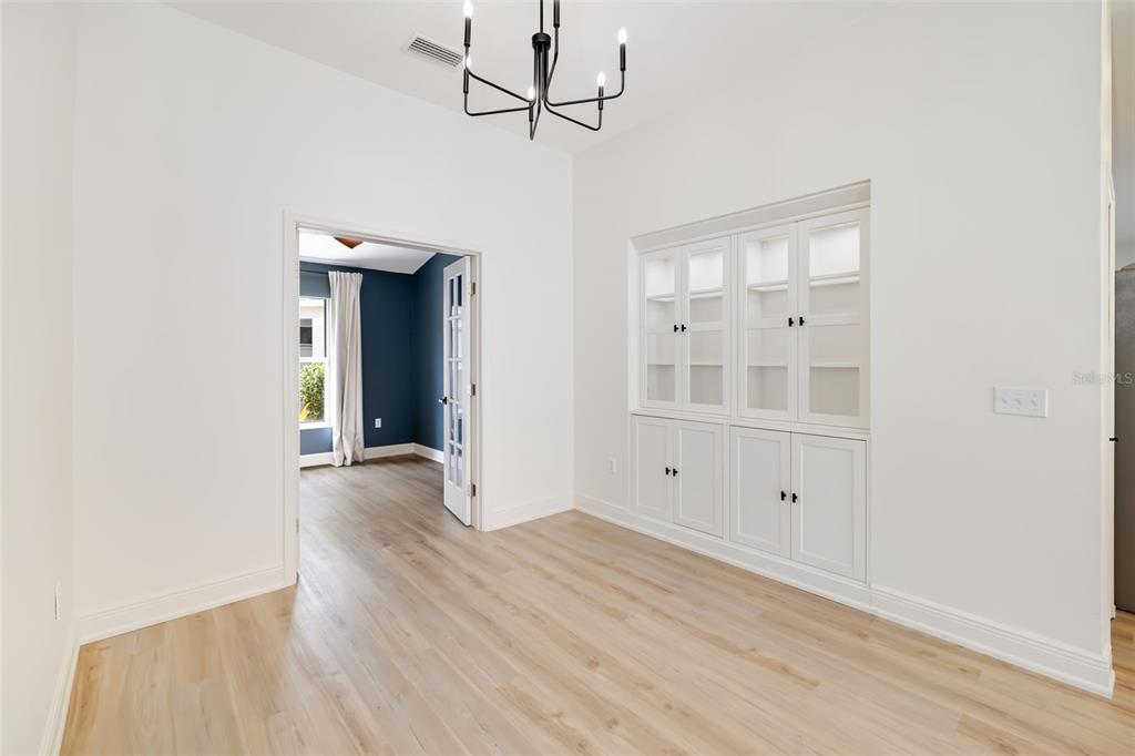 6226 Blueflower Court Lakewood Ranch, FL 34202 - Photo 12 of 81 a view of empty room with wooden floor and fan