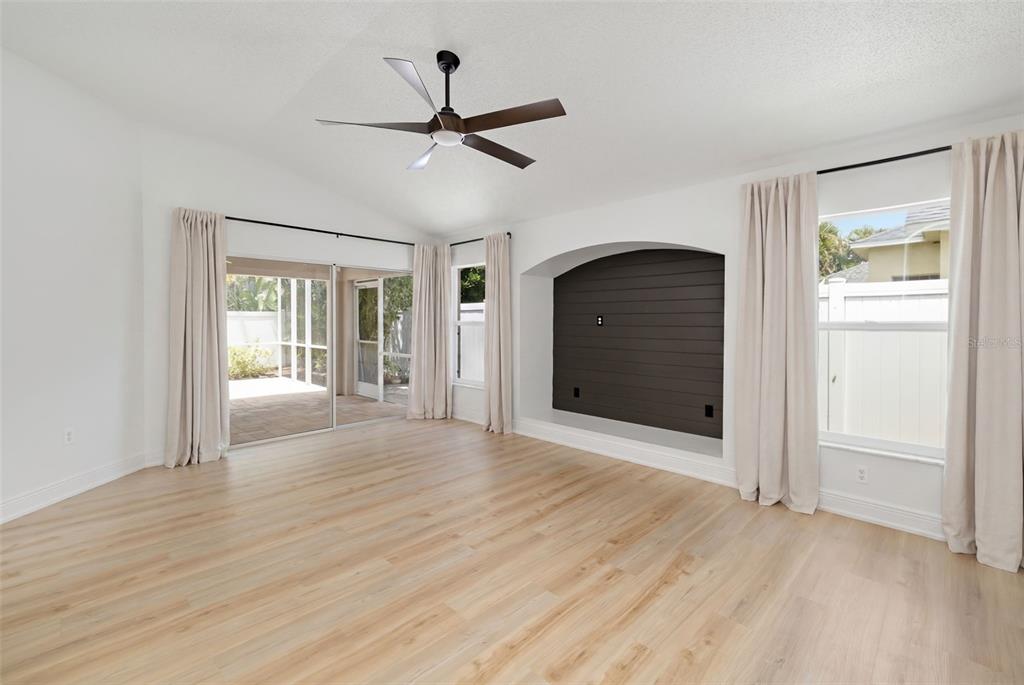 6226 Blueflower Court Lakewood Ranch, FL 34202 - Photo 20 of 81 a view of empty room with wooden floor and fan