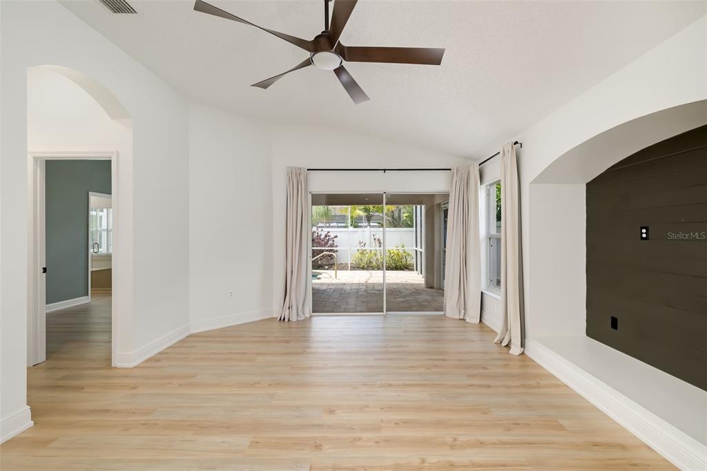 6226 Blueflower Court Lakewood Ranch, FL 34202 - Photo 22 of 81 a view of empty room with wooden floor and fan