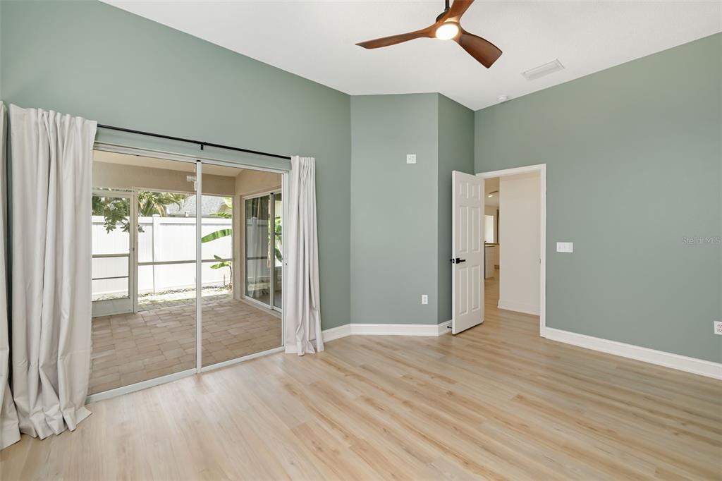 6226 Blueflower Court Lakewood Ranch, FL 34202 - Photo 29 of 81 wooden floor in an empty room with a window