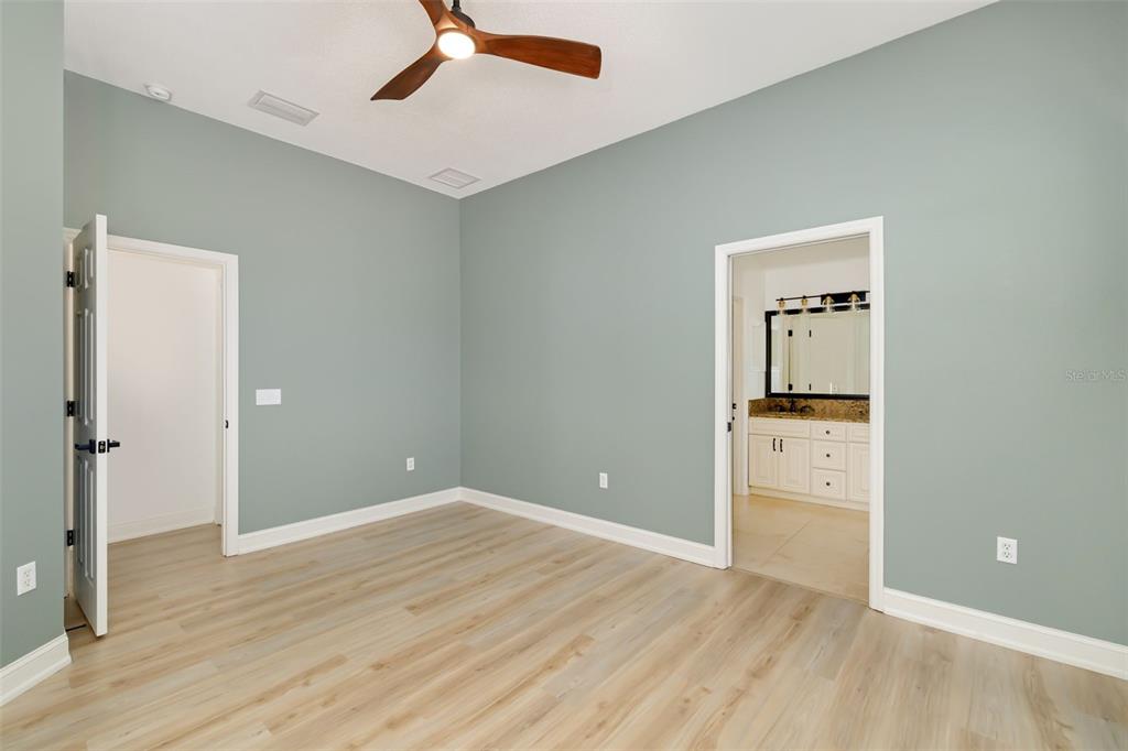 6226 Blueflower Court Lakewood Ranch, FL 34202 - Photo 31 of 81 a view of empty room with wooden floor