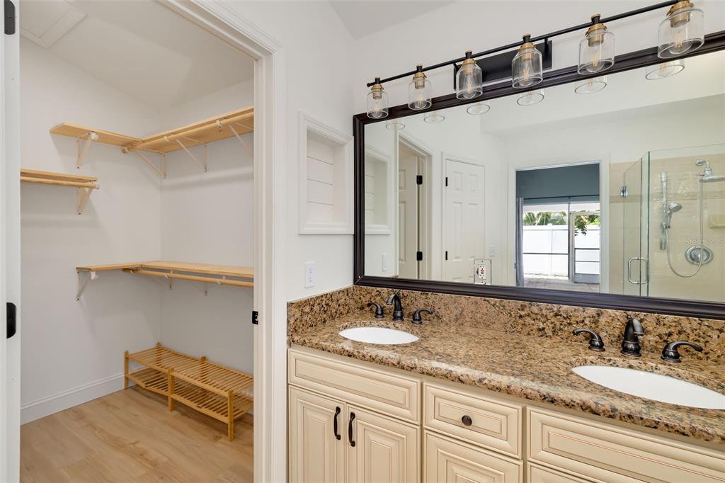 6226 Blueflower Court Lakewood Ranch, FL 34202 - Photo 34 of 81 a bathroom with a granite countertop sink mirror and double
