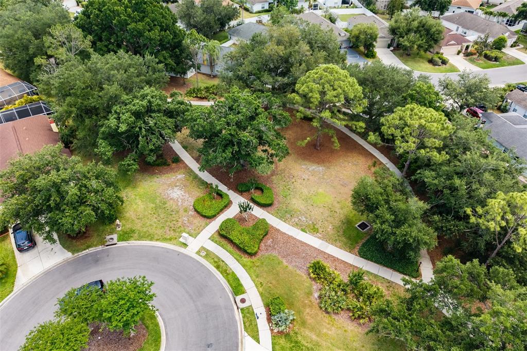 6226 Blueflower Court Lakewood Ranch, FL 34202 - Photo 44 of 81 an aerial view of a house with a yard and lake view