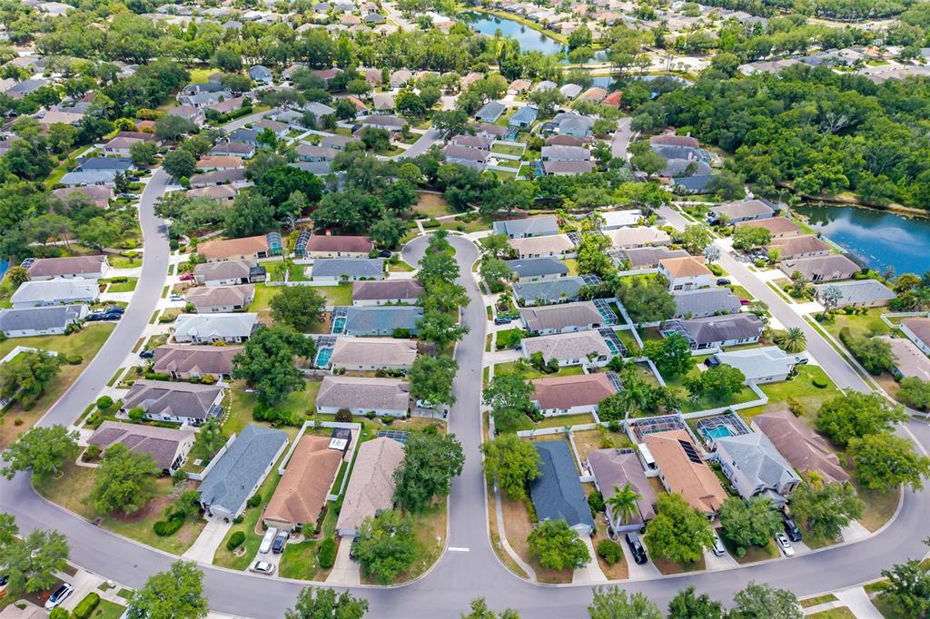 6226 Blueflower Court Lakewood Ranch, FL 34202 - Photo 48 of 81 an aerial view of residential houses with outdoor space