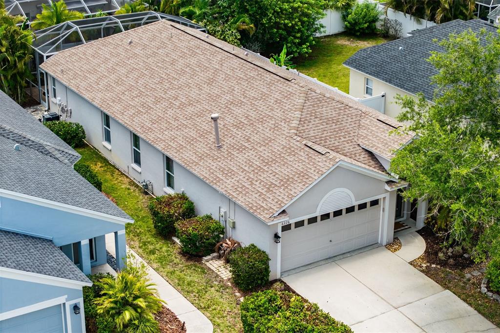 6226 Blueflower Court Lakewood Ranch, FL 34202 - Photo 50 of 81 an aerial view of a house with a yard and potted plants