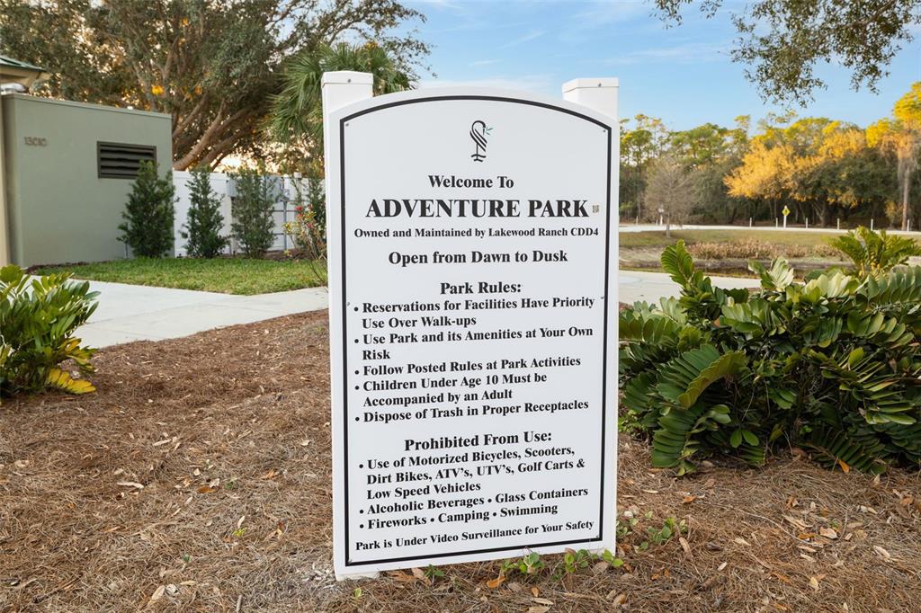 6226 Blueflower Court Lakewood Ranch, FL 34202 - Photo 67 of 81 a sign on the side of a road