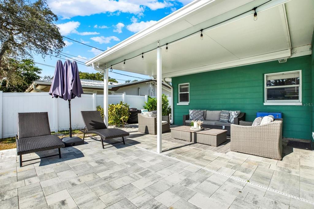 1241 12th Court Southwest Largo, FL 33770 - Photo 24 of 32 a building outdoor space with patio furniture and potted plants